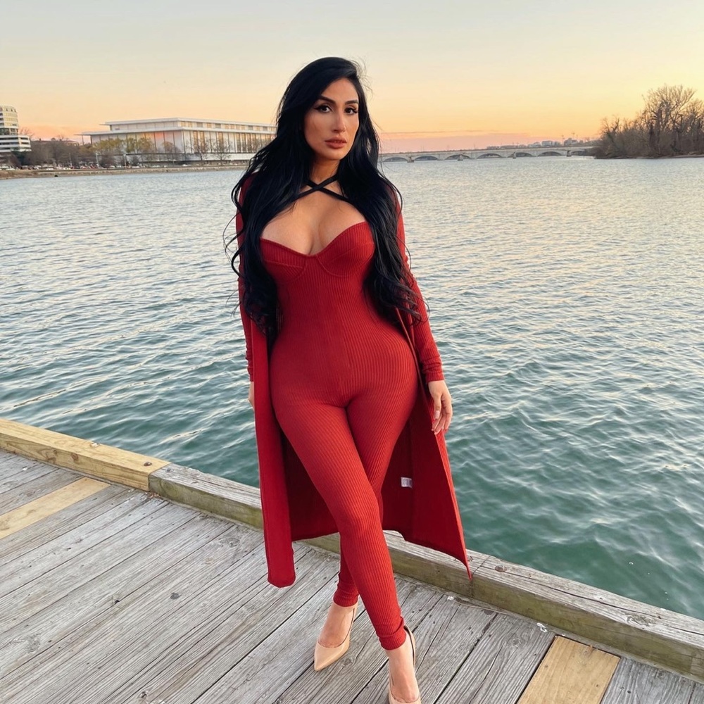 Orange-red jumpsuit with cape